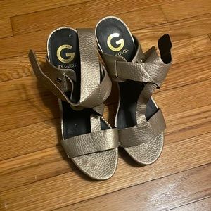 Guess super high heel in Gold with ankle straps.